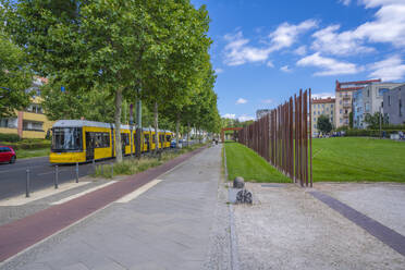 View of yellow city tram at the Berlin Wall Memorial, Memorial Park, Bernauer Strasse, Berlin, Germany, Europe - RHPLF28928