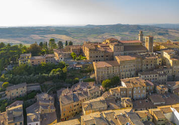 Elevated view of rooftops and town of Montepulciano at sunset, Montepulciano, Tuscany, Italy, Europe - RHPLF28944