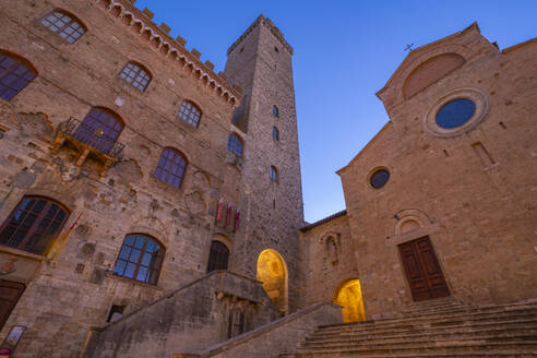 View of Duomo di San Gimignano in Piazza del Duomo at dusk, San Gimignano, UNESCO World Heritage Site, Province of Siena, Tuscany, Italy, Europe - RHPLF28980