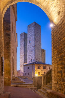 View of towers in Piazza del Duomo at dusk, San Gimignano, UNESCO World Heritage Site, Province of Siena, Tuscany, Italy, Europe - RHPLF28986