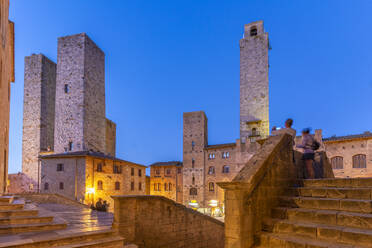 View of towers in Piazza del Duomo at dusk, San Gimignano, UNESCO World Heritage Site, Province of Siena, Tuscany, Italy, Europe - RHPLF28996