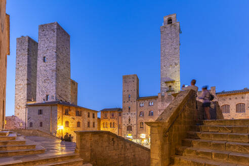 View of towers in Piazza del Duomo at dusk, San Gimignano, UNESCO World Heritage Site, Province of Siena, Tuscany, Italy, Europe - RHPLF28996