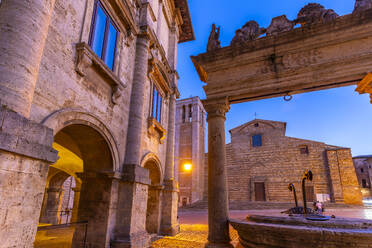 View of Pozzo dei Grifi e dei Leoni an Duomo in Piazza Grande at dusk, Montepulciano, Province of Siena, Tuscany, Italy, Europe - RHPLF29060