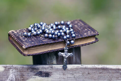 Bible and Catholic rosary beads on wood, Les Contamines, Haute-Savoie, France, Europe - RHPLF29204