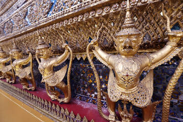 Golden sculptures of Garuda and Naga, Wat Phra Kaew (Temple of the Emerald Buddha), Bangkok, Thailand, Southeast Asia, Asia - RHPLF29227