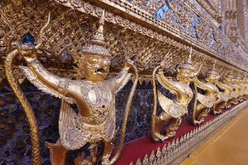 Golden sculptures of Garuda and Naga, Wat Phra Kaew (Temple of the Emerald Buddha), Bangkok, Thailand, Southeast Asia, Asia - RHPLF29250