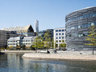 Law Courts with Turning Torso in the background, Malmo, Sweden, Scandinavia, Europe - RHPLF29312