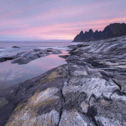 Coastal view at dawn of Devil's Teeth Mountain, Tungeneset, Senja, Troms og Finnmark, Norway, Scandinavia, Europe - RHPLF29612