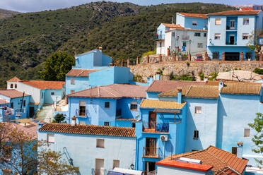 Street in blue painted Smurf house village of Juzcar, Pueblos Blancos region, Andalusia, Spain, Europe - RHPLF29672