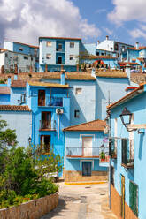 Village street in blue painted Smurf house village of Juzcar, Pueblos Blancos region, Andalusia, Spain, Europe - RHPLF29678