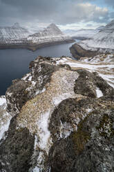 Fjord view and snow covered rocks and mountains, Funningur, Esturoy Island, Faroe Islands, Denmark, Europe - RHPLF29750