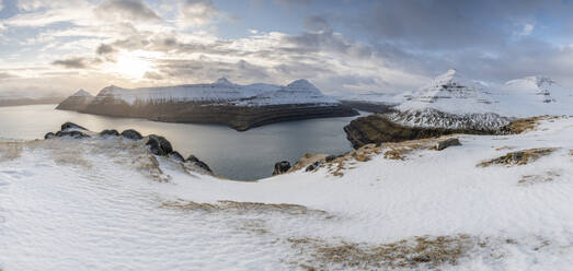 Snow-covered cliffs and mountains along Funningur fjord, Eysturoy Island, Faroe Islands, Denmark, Europe - RHPLF29798