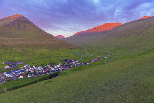 Early morning on Gjogv village with the mountain peaks lit by the sun, Eysturoy island, Faroe islands, Denmark, Europe - RHPLF29851