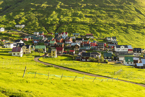 The colorful houses of the fishing village of Funningur at sunrise, Eysturoy island, Faroe islands, Denmark, Europe - RHPLF29853
