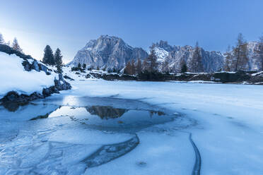 Dusk on the frozen lake of Limides, Falzarego mountain pass, Dolomites, South Tyrol, Italy, Europe - RHPLF29860