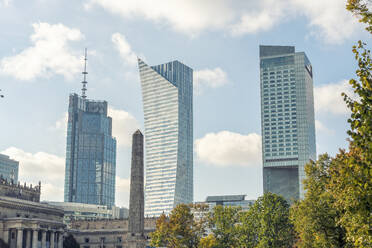 Poland, Mazowieckie, Warsaw, City center with modern glass skyscrapers - TAMF04006