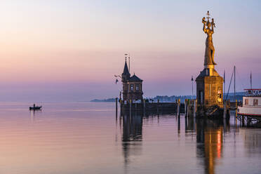 Germany, Baden-Wurttemberg, Konstanz, Harbor on shore of Bodensee at dawn with Imperia statue in foreground - WDF07455