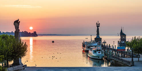 Germany, Baden-Wurttemberg, Konstanz, Panoramic view of harbor on shore of Bodensee at sunrise - WDF07457