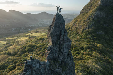 Aerial view of people climbing on Piton Jacob Peak mountain in Port Louis, Mauritius. - AAEF24611