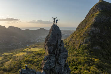 Aerial view of people climbing on Piton Jacob Peak mountain in Port Louis, Mauritius. - AAEF24613