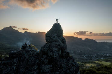 Aerial view of people climbing on Piton Jacob Peak mountain in Port Louis, Mauritius. - AAEF24620