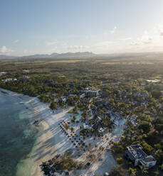 Aerial view of hotels and resorts along the coastline in Poste de Flacq facing the ocean in Flacq district, Mauritius. - AAEF24633