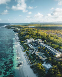 Aerial view of a hotel resort along the coastline on the beachfront in Poste Lafayette, Flacq District, Mauritius. - AAEF24646