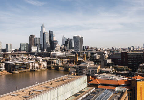 Panoramic view over the River Thames towards the skyline of London's financial district featuring iconic modern architecture on a clear day. - ADSF49966