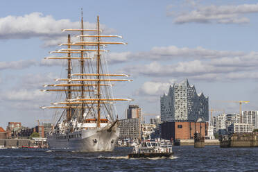 Germany, Hamburg, Sailing ship with Elbphilharmonie in background - KEBF02789