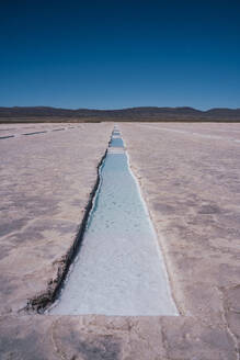 Lake near salt flat in front of mountain - RSGF01002