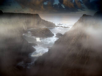 Portugal, Alentejo, Cliffs of Cabo Sardao on foggy day - DSGF02443