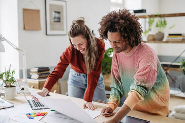 Young colleagues working together in a startup company. - HPIF31318