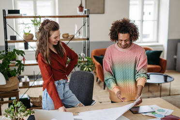 Young colleagues working together in a startup company. - HPIF31319