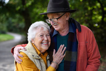 Portrait of senior couple in love at walk in a park. - HPIF31625