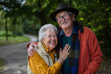 Portrait of senior couple in love at walk in a park. - HPIF31626