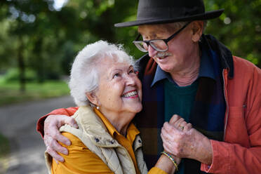Portrait of senior couple in love at walk in a park. - HPIF31627