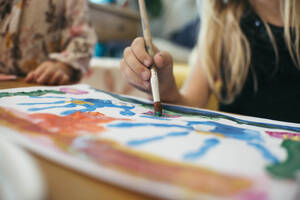 Children drawing with paintbrush and watercolor at home - ASHF00031