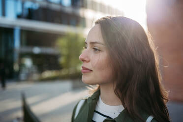 Portrait of a young woman in a city. - HPIF31966