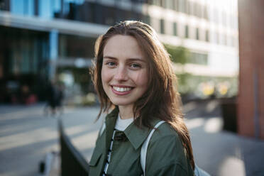 Portrait of a young woman in a city. - HPIF31967