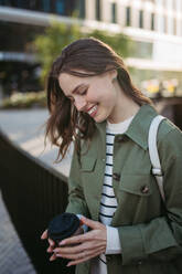 Portrait of a young woman in a city. - HPIF31974