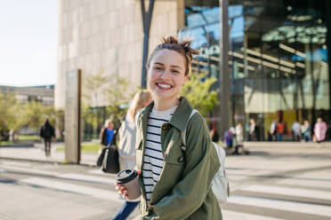 Portrait of a young woman in a city. - HPIF31985