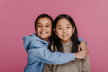 Portrait of two children, studio shoot. Concept of diversity in a friendship. - HPIF32004