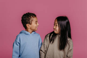 Portrait of two children, studio shoot. Concept of diversity in a friendship. - HPIF32007