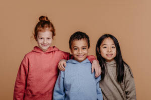 Portrait of three children, studio shoot. Concept of diversity in a friendship. - HPIF32010