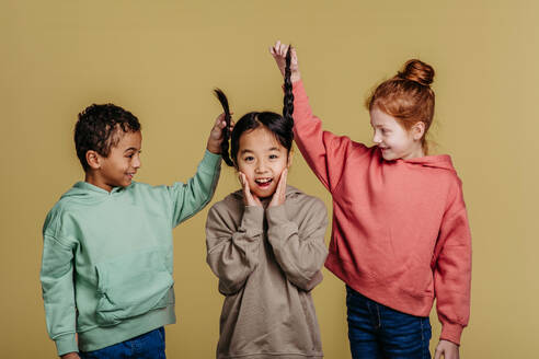 Portrait of three children, studio shoot. Concept of diversity in a friendship. - HPIF32031