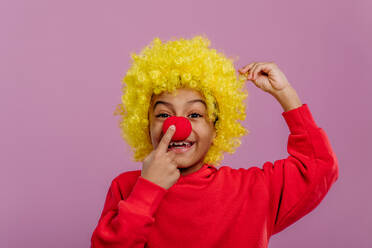 Portrait of little boy in clown costume, studio shoot. - HPIF32044