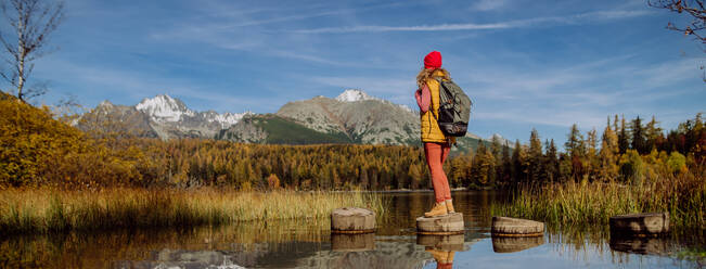 Rear view of woman enjoyingmountains view. - HPIF32114