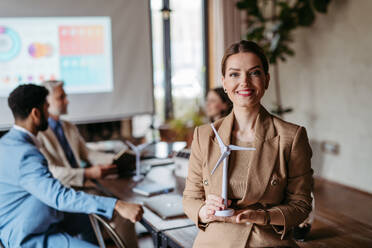 Portrait of confident businesswoman during team meeting. Powerful female business leader, ceo. - HPIF32359