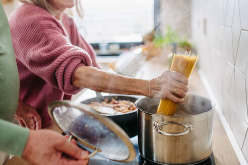 Senior couple cooking together in the kitchen. - HPIF32472