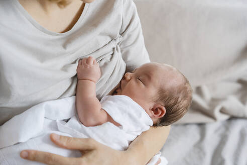 Mother breastfeeding baby boy in arms - NDEF01461